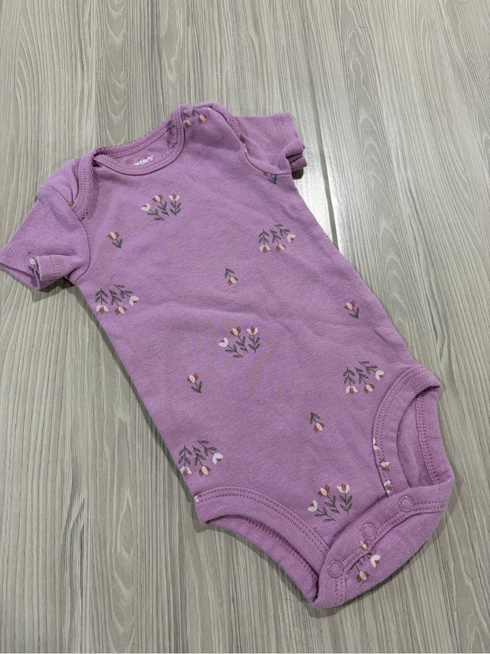 7/$20 Carter’s Kids Purple Floral One-Piece Bodysuit